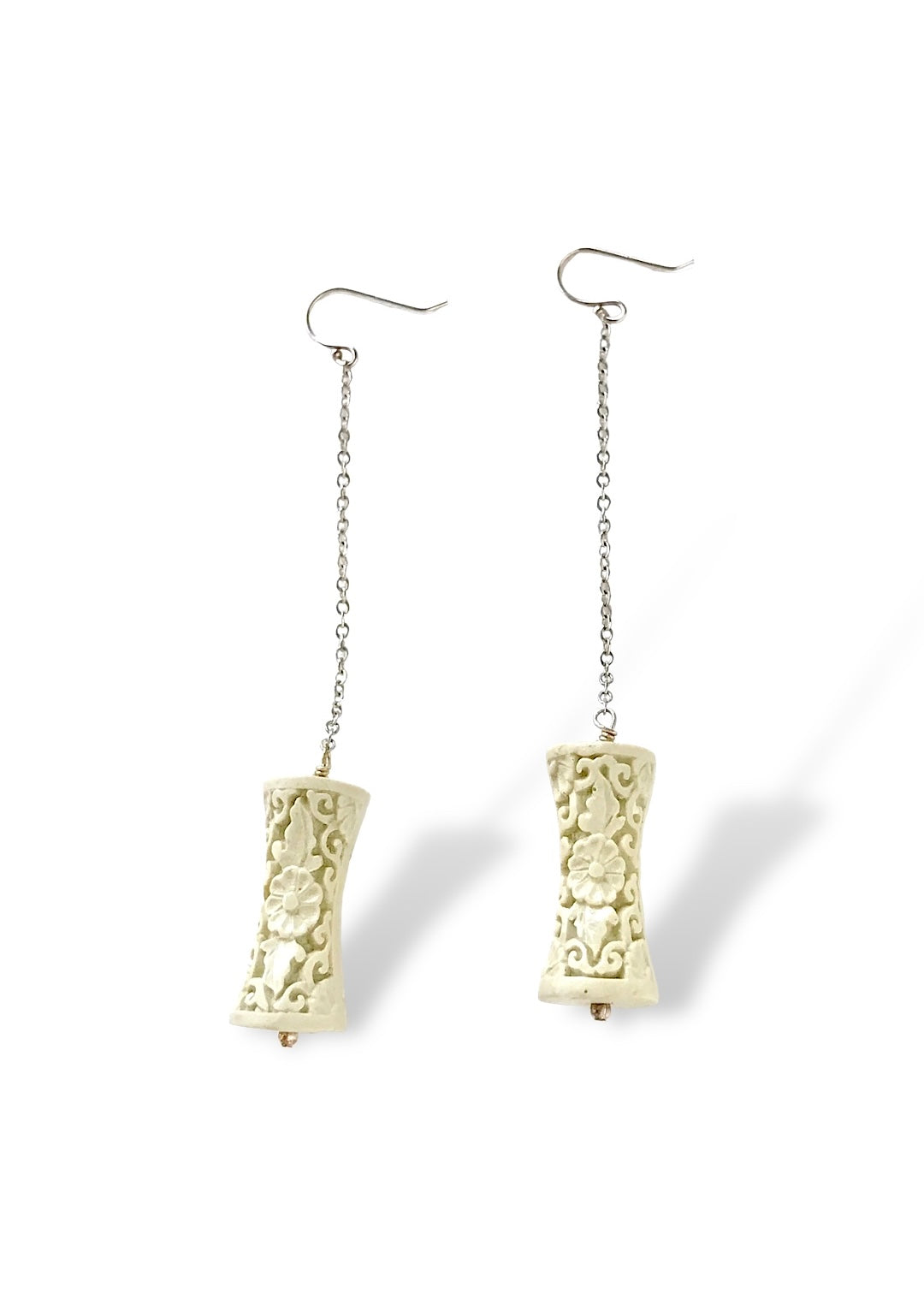 Carved White Resin and Silver Dangle Earrings